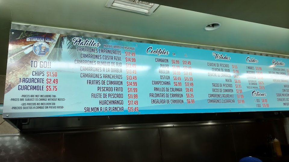 Printed seafood menu with tacos and oysters